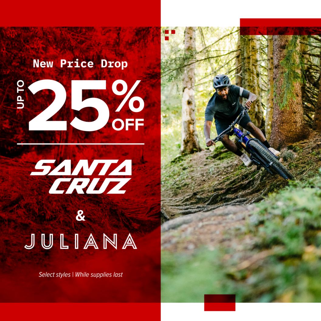 Text reading “New price drop, up to 25% off select models of Santa Cruz & Juliana, while supplies last” is shown over an image of a mountain bike rider descending through an ivy-laced forest trail.