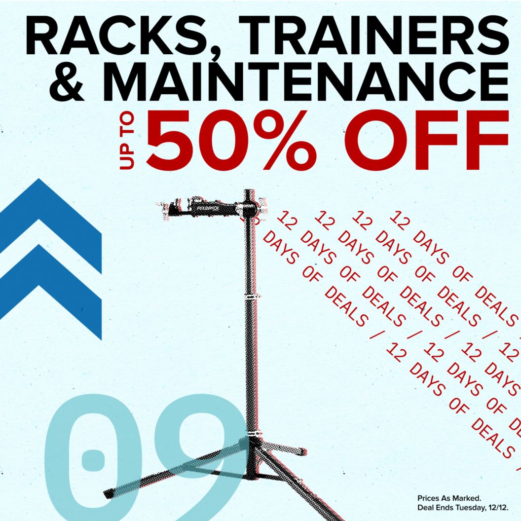 Racks, trainers, and maintenance up to 50% off text reads above 12 days of deals text. On the left is a bike-work stand and dash and chevron graphics next to a 09 indicating the day of the deal. Prices as marked. Deal ends Tuesday, 12/12 disclaimer. 
