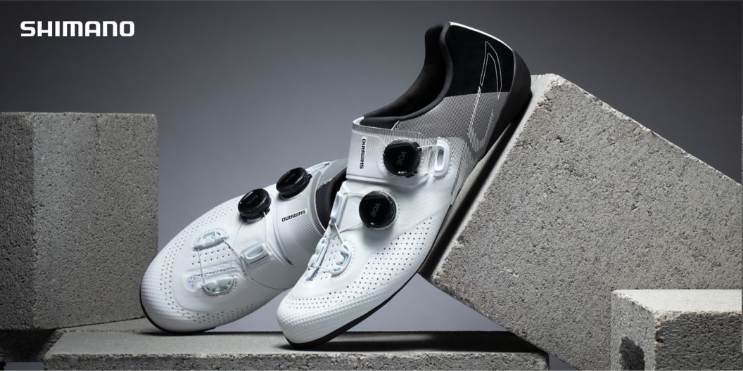  Shimano RC702 shoes are shown propped on cinderblocks. 