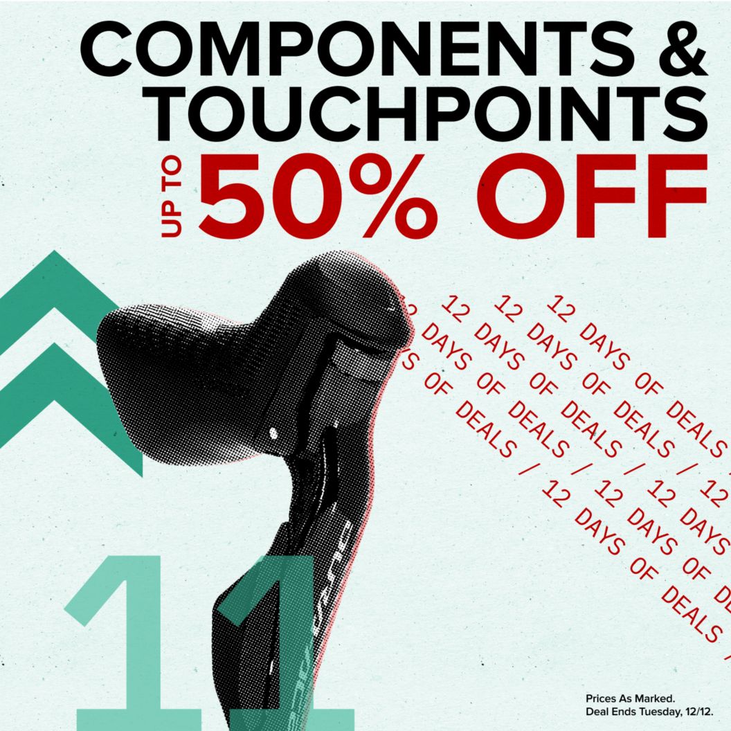 Components and touchpoints up to 50% off text reads above 12 days of deals text. On the left is a shifter/brakeset and dash and chevron graphics next to a 11 indicating the day of the deal. Prices as marked. Deal ends Tuesday, 12/12 disclaimer. 