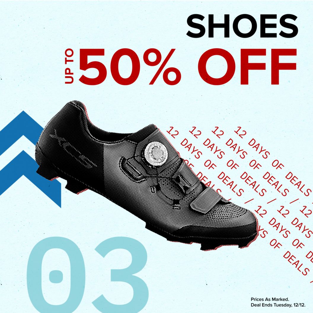 Shoes up to 50% off text reads above 12 days of deals text. On the left is a Shimano MTB shoe and dash and chevron graphics next to a 03 indicating the day of the deal. Prices as marked. Deal ends Tuesday, 12/12 disclaimer. 