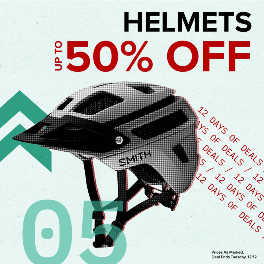 Helmets up to 50% off text reads above 12 days of deals text. On the left is a Smith trail helmet and dash and chevron graphics next to a 05 indicating the day of the deal. Prices as marked. Deal ends Tuesday, 12/12 disclaimer. 