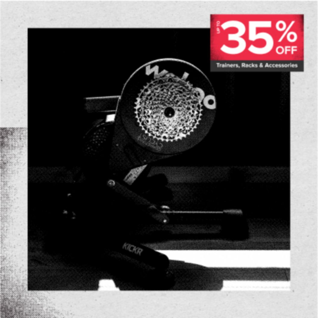 Up to 35% off trainers, racks, and accessories in a red box over a black and white image of a Wahoo KICKR trainer in a shadowy indoor scene.  
