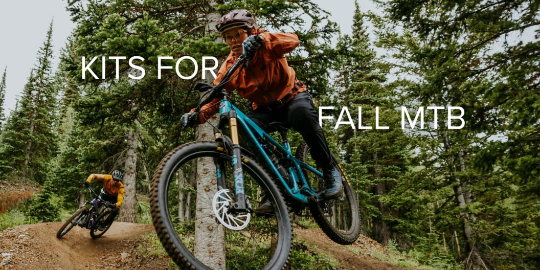 “Kits for fall MTB” text over an image of two riders enjoying an alpine trail. 