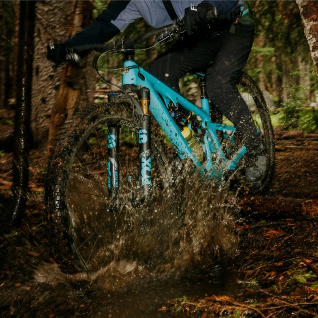   A rider takes on a descent on a Yeti MTB.