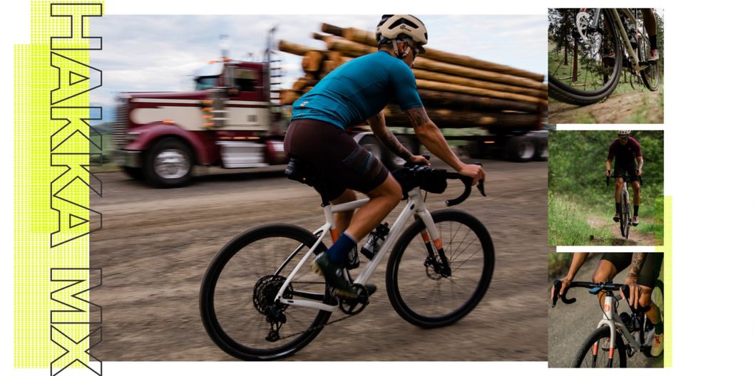 A rider quickly pedals the Hakka on smooth gravel as a log-carrying big rig speeds in the opposite direction.