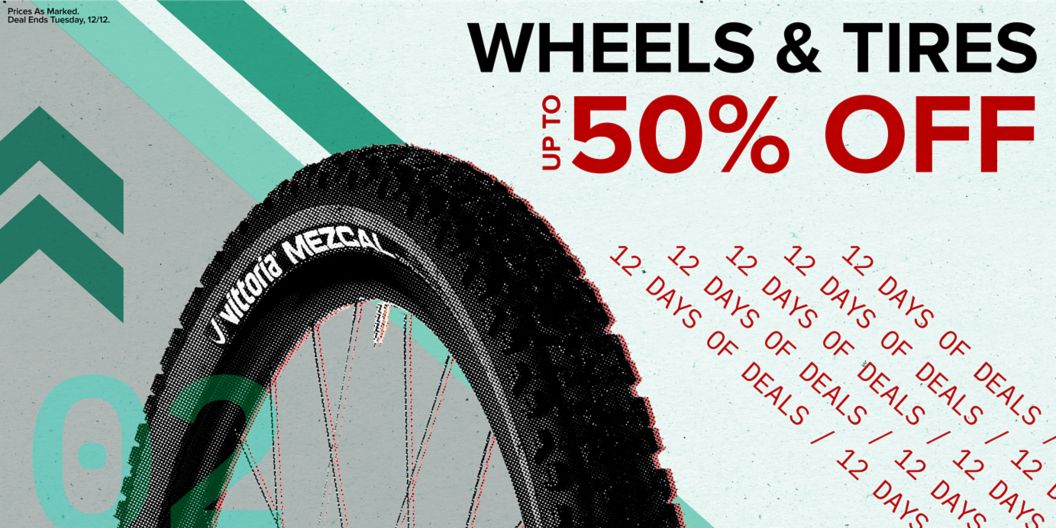 Wheels and tires up to 50% off text reads above 12 days of deals text. On the left is an MTB tire and wheel and dash and chevron graphics next to a 02 indicating the day of the deal. Prices as marked. Deal ends Tuesday, 12/12 disclaimer. 