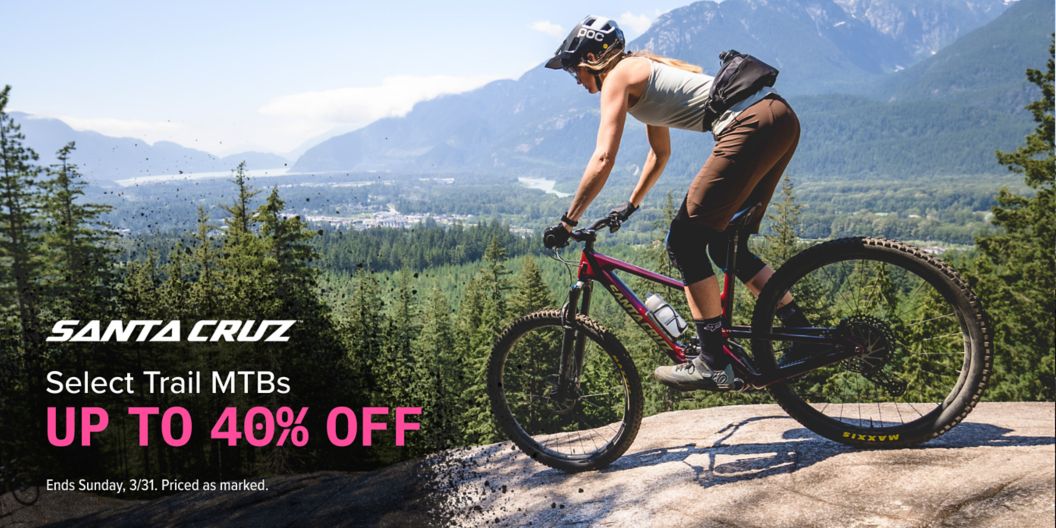 Santa Cruz sale on select MTBs up to 40% off ends Sunday, 3/31. Priced as marked. An image of a rider hucking a gap on a Santa Cruz. 