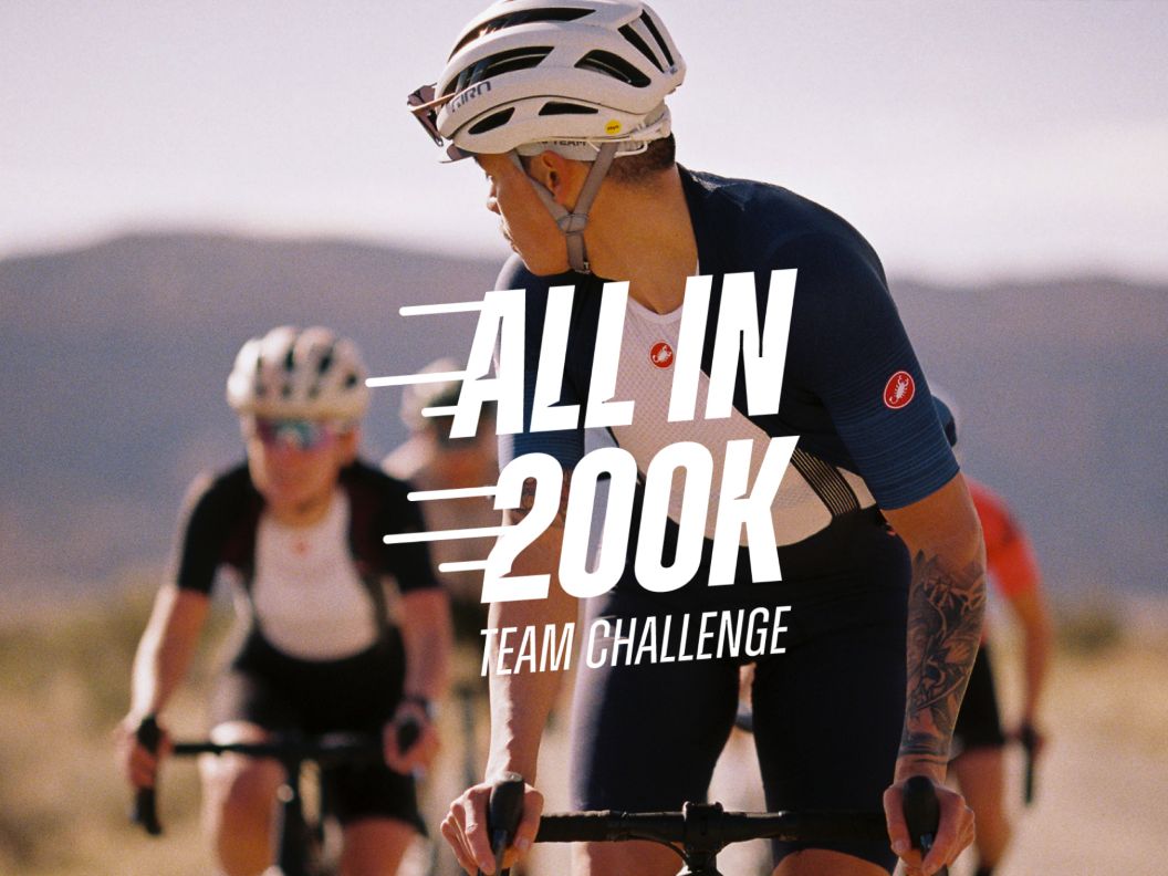 A rider in front looks back at three riders behind. All in 200k Team Challenge graphic is displayed. 