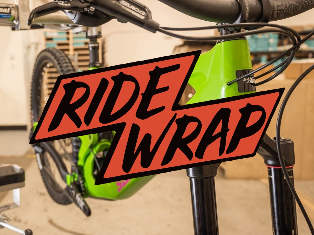 Bike frame with 'Ride Wrap' logo graphic centered over top.