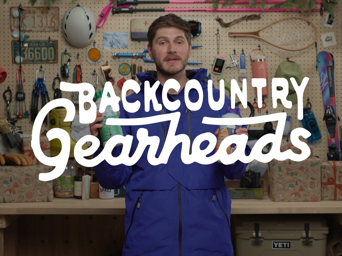 Backcountry Gearhead overlay over personstanding in a gear room.