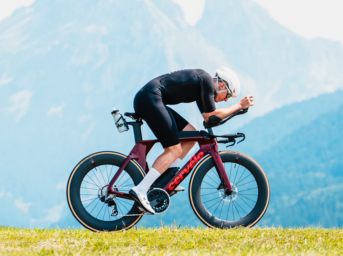 A cyclist in a tuck position.