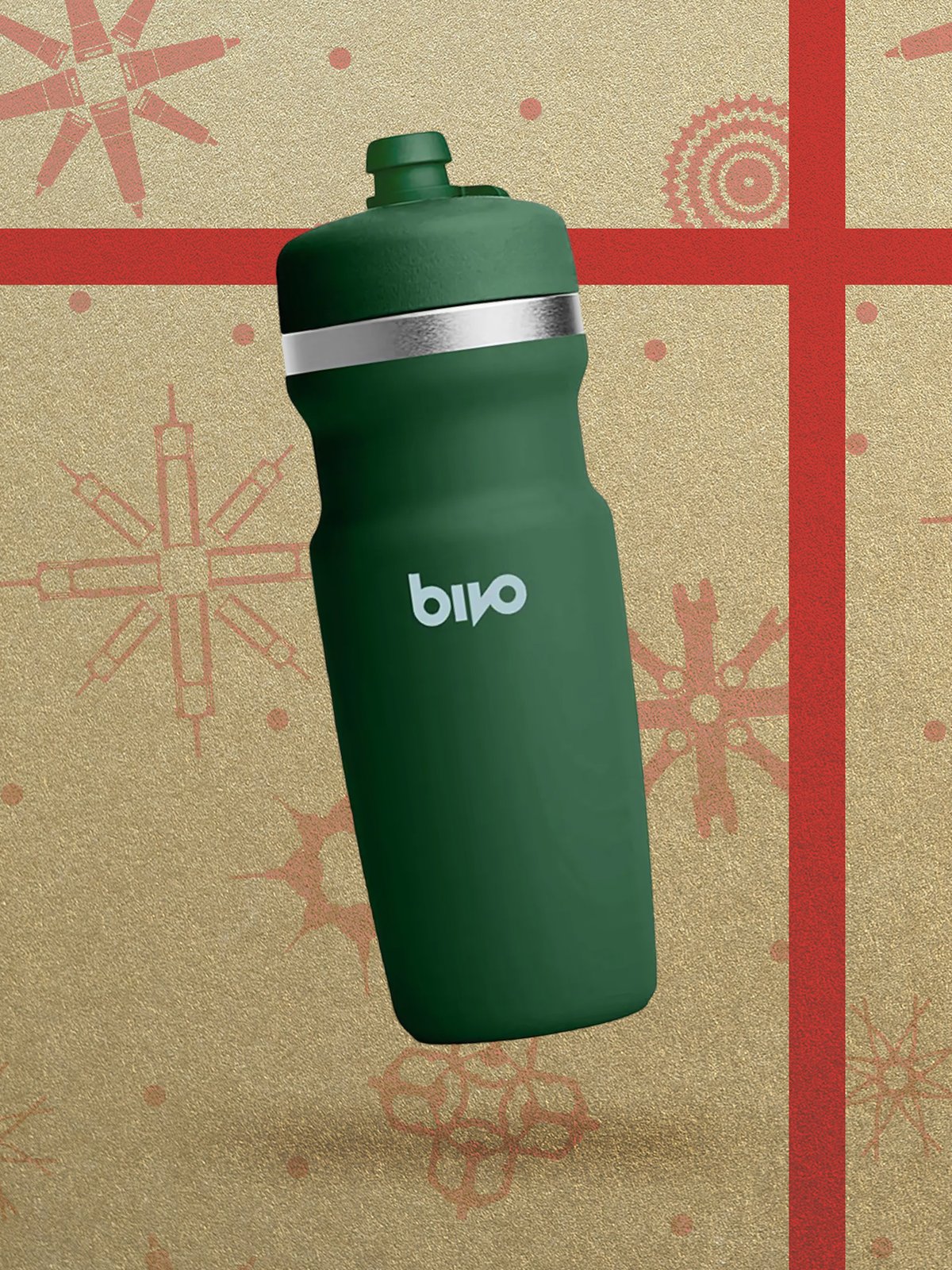 A green Bivo insulated water bottle displayed in front of a gift wrapping.