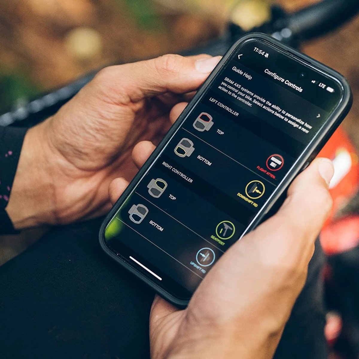 Person customizing Reverb AXS dropper settings in phone app.