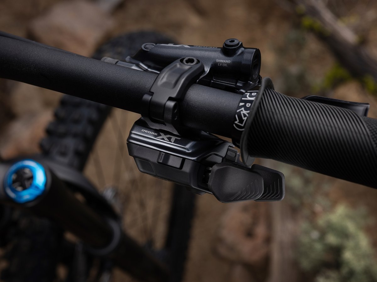 Closeup of a handlebar equipped with XT brakes and shifters.