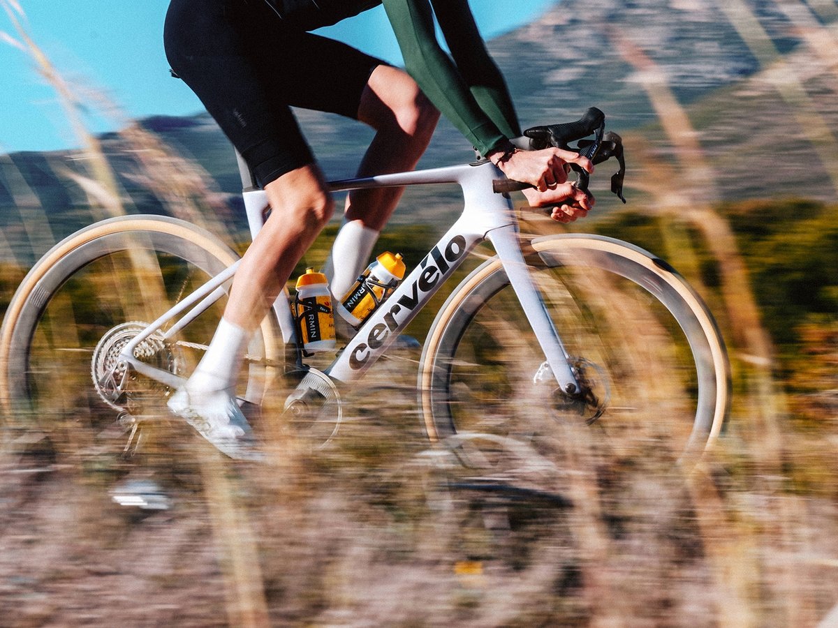 The Aspero 5 in action, riding through a field of tall grasses.