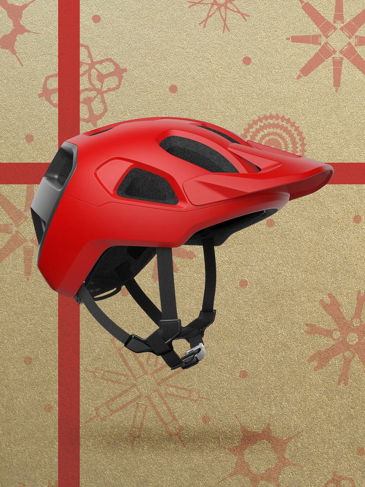 A red mountain bike helmet displayed against a gold background with red holiday-themed patterns and stripes.