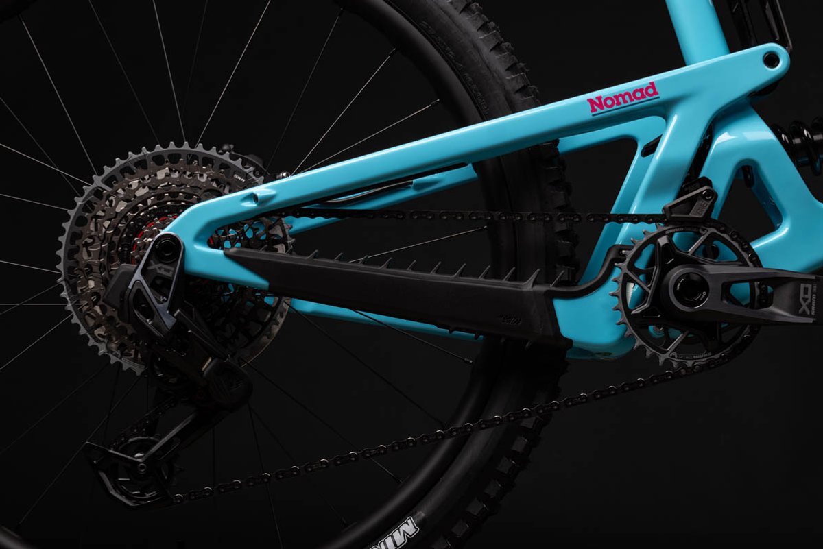 Enduro mountain bike rear triangle showing size-specific chainstay length with SRAM cassette and single chainring drivetrain
