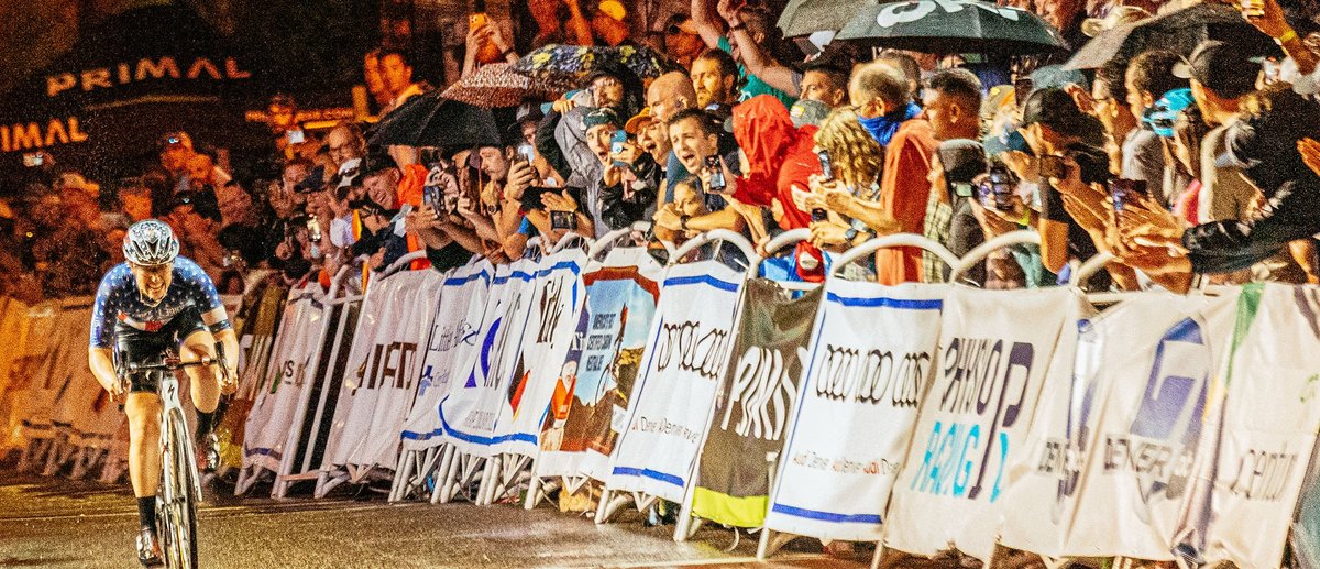 Fans cheer for Kendall Ryan as she races solo in a criterium.