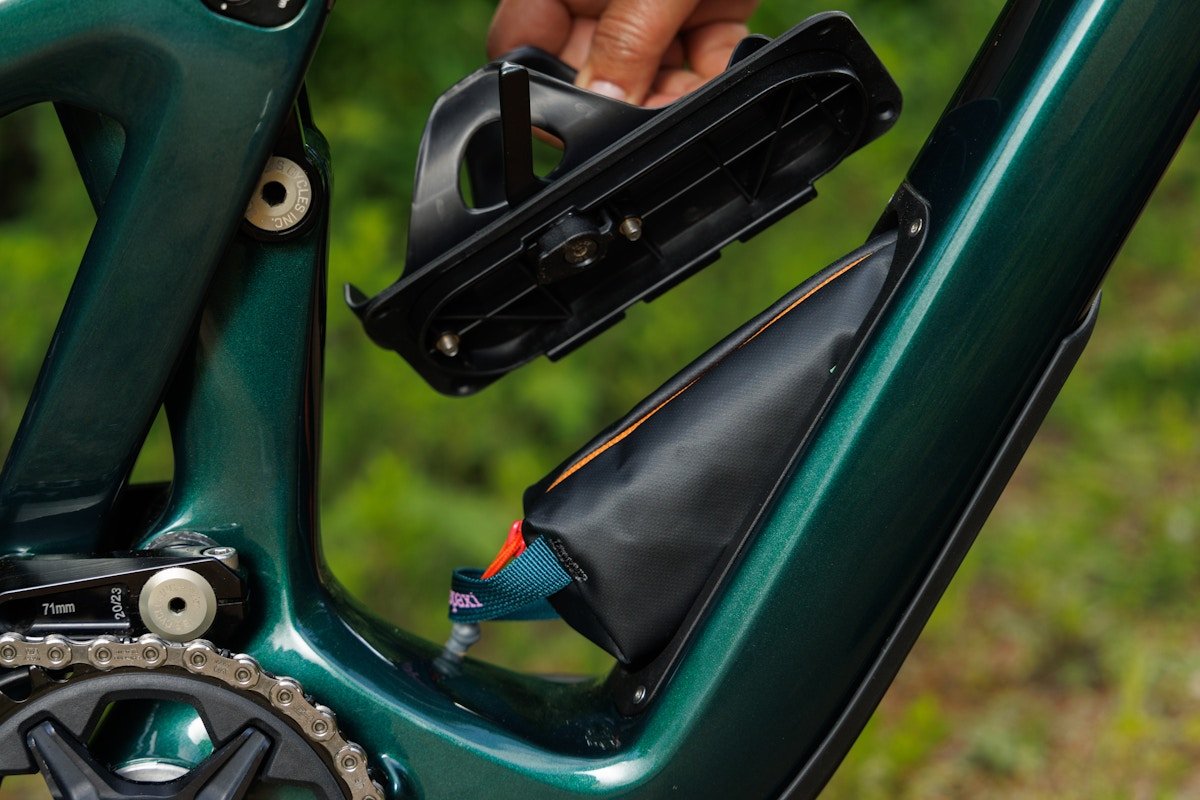 Close detail shot of Ibis Ripley internal frame storage system with an internal storage bag sticking out of the opening.