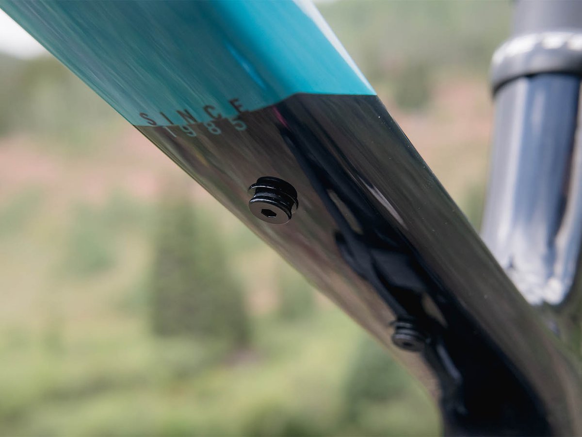 Close-up of the threaded top tube accessory mount on the Yeti MT, next to the "Since 1985" graphic.