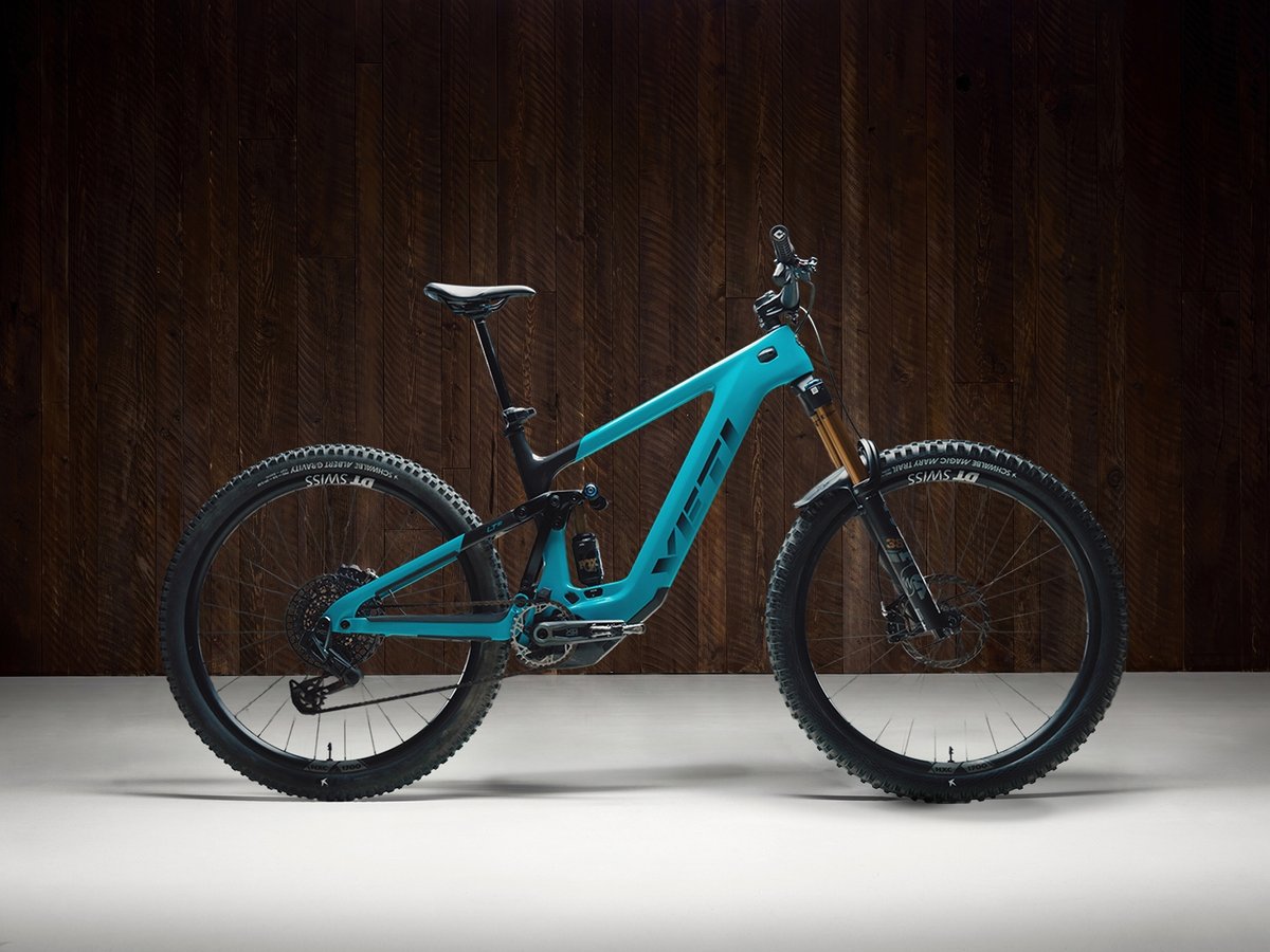 Yeti LTe T3 mountain bike shown against a dark wood studio background.