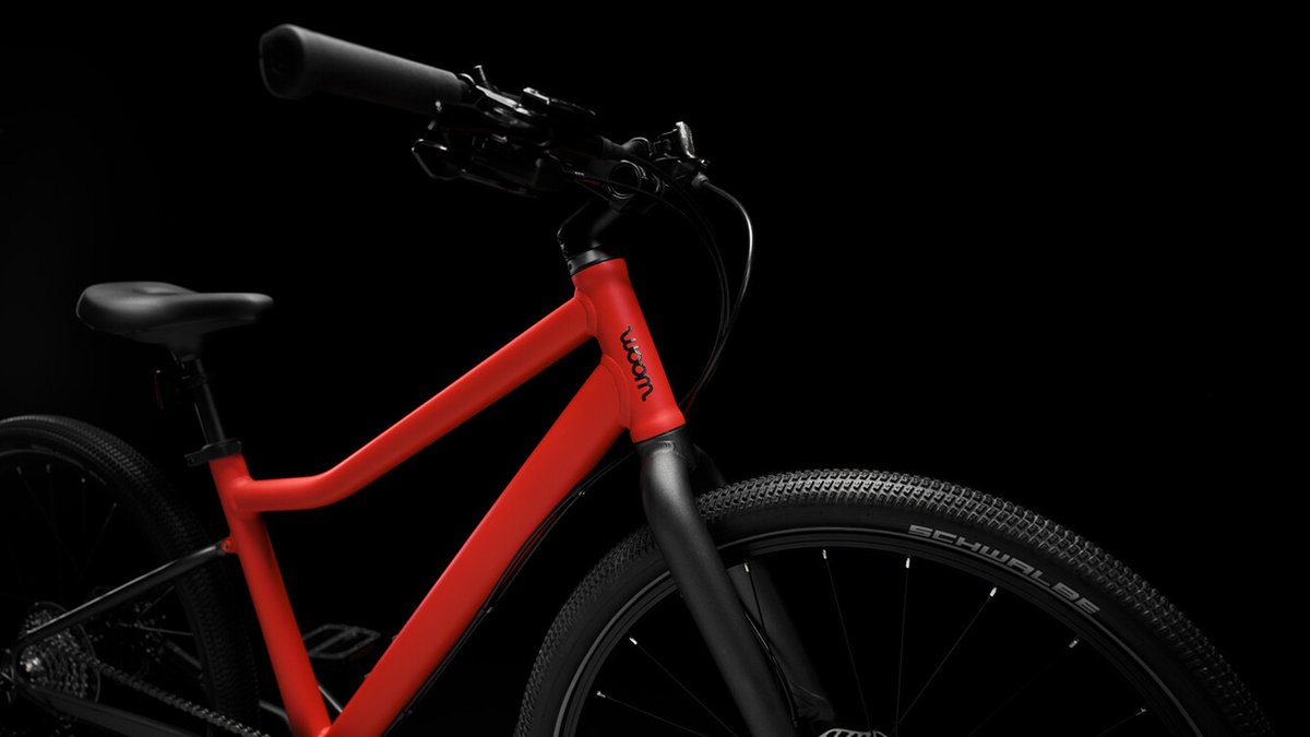 Detail shot of Woom Explore bike from side profile view.