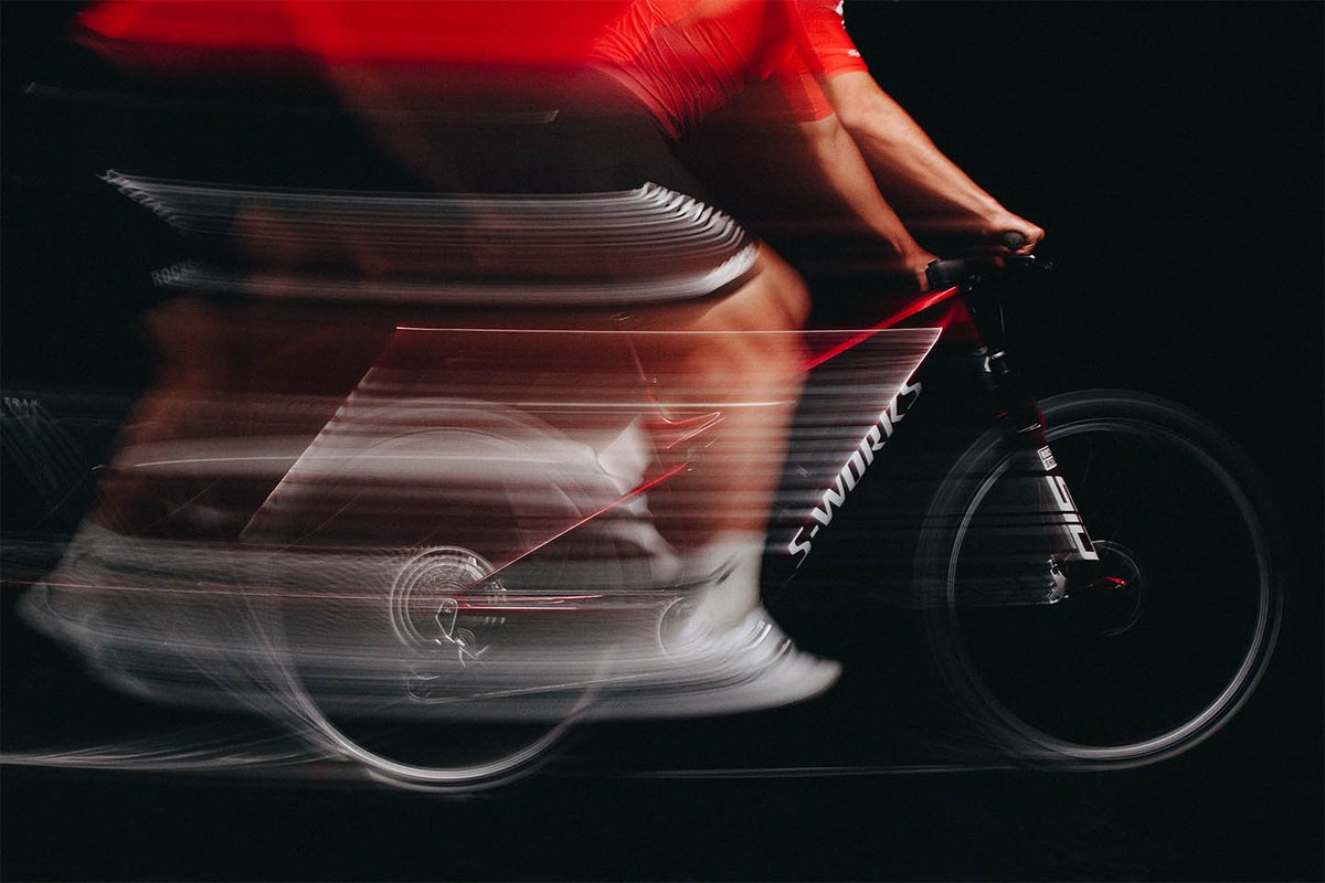 Blurred motion studio shot of Specialized Epic 9 S-Works bike.