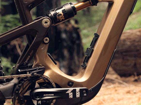 Close-up of integrated battery extender mounted on water bottle holder.