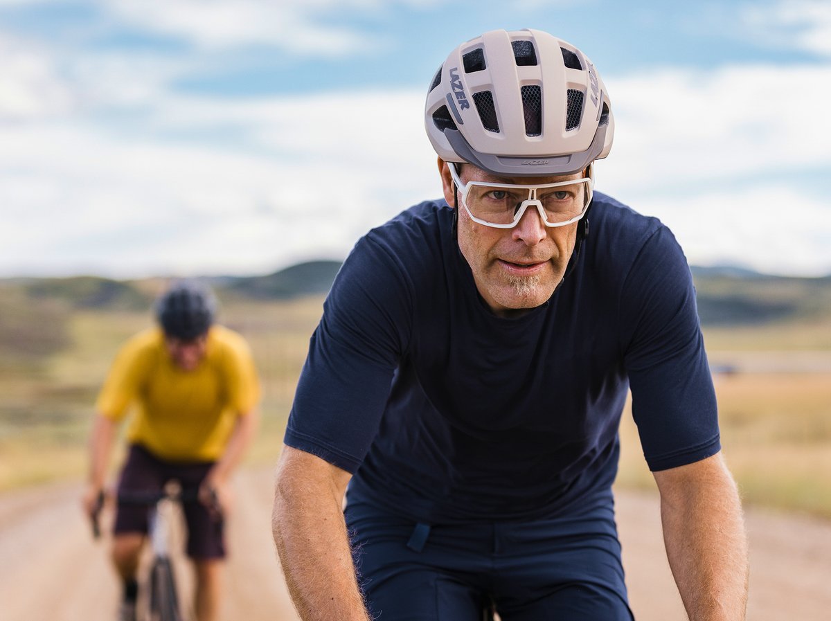 Two gravel riders wearing Lazer helmets.