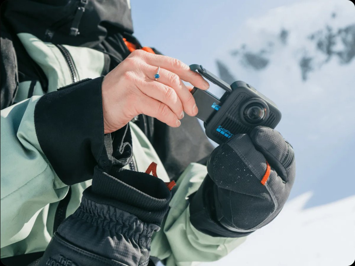 Person placing battery inside the camera.