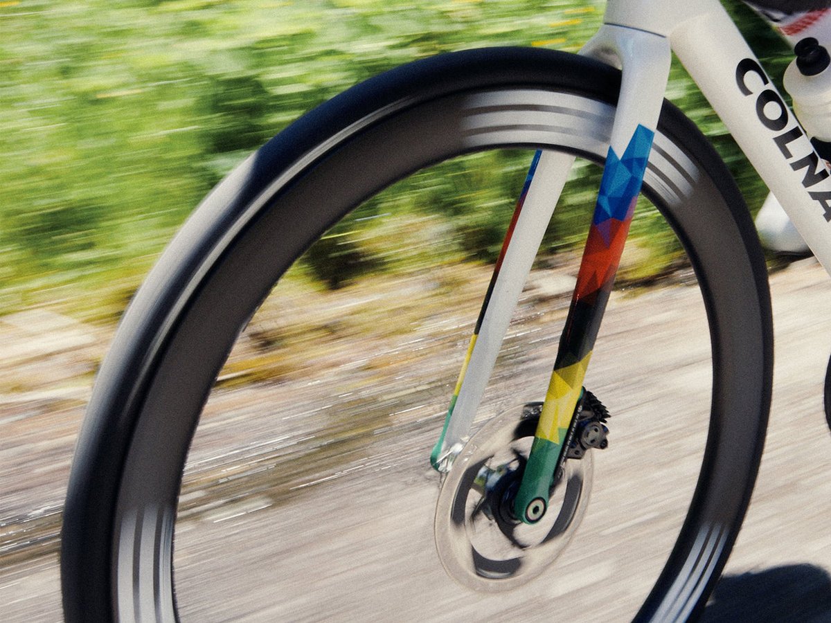 Close up of a front wheel spinning in motion.