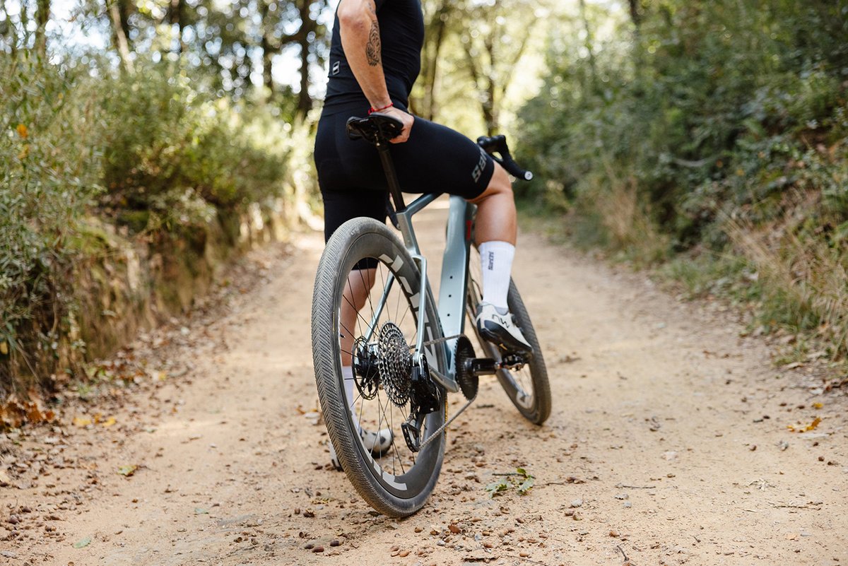 Rider sitting on his bike on a dirt path.
