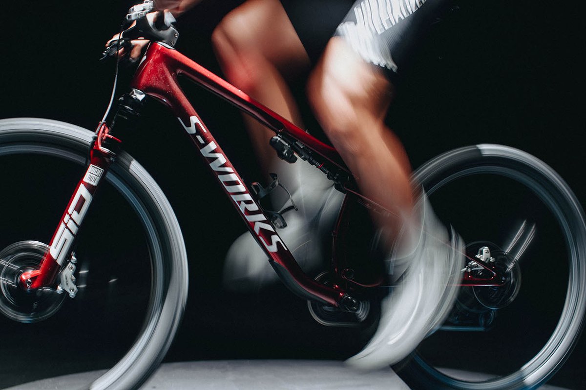Person pedaling on Specialized Epic 9 S-Works bike.