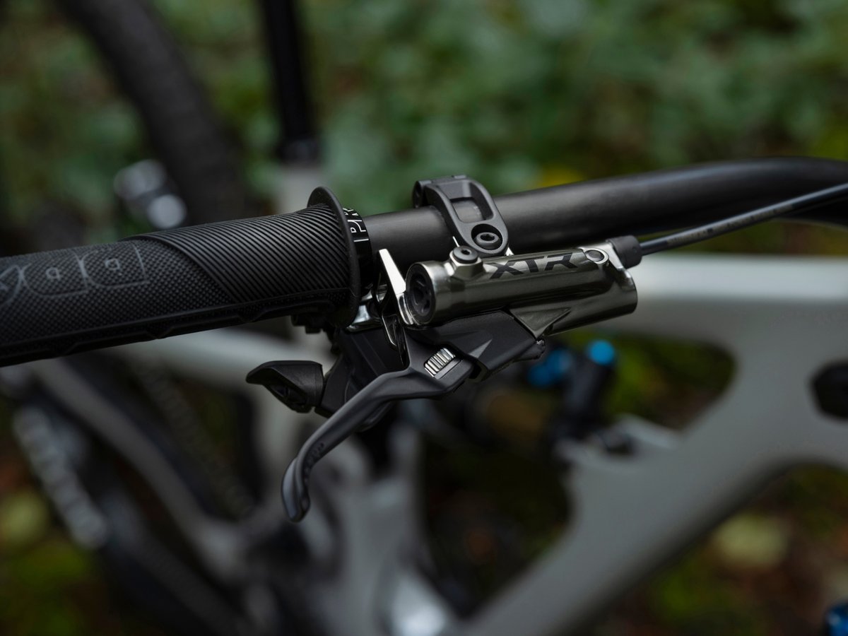 Closeup of a handlebar equipped with XTR brakes and shifters.