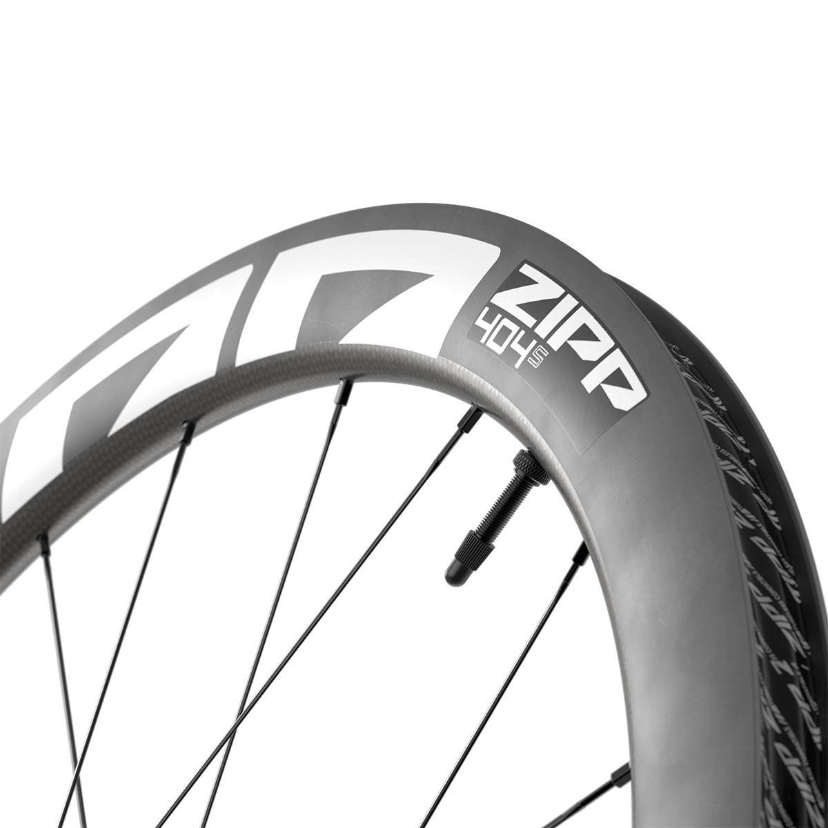 Close-up of the Zipp 404 S carbon rim showing the model name, valve stem, and deep aero profile against a white background.