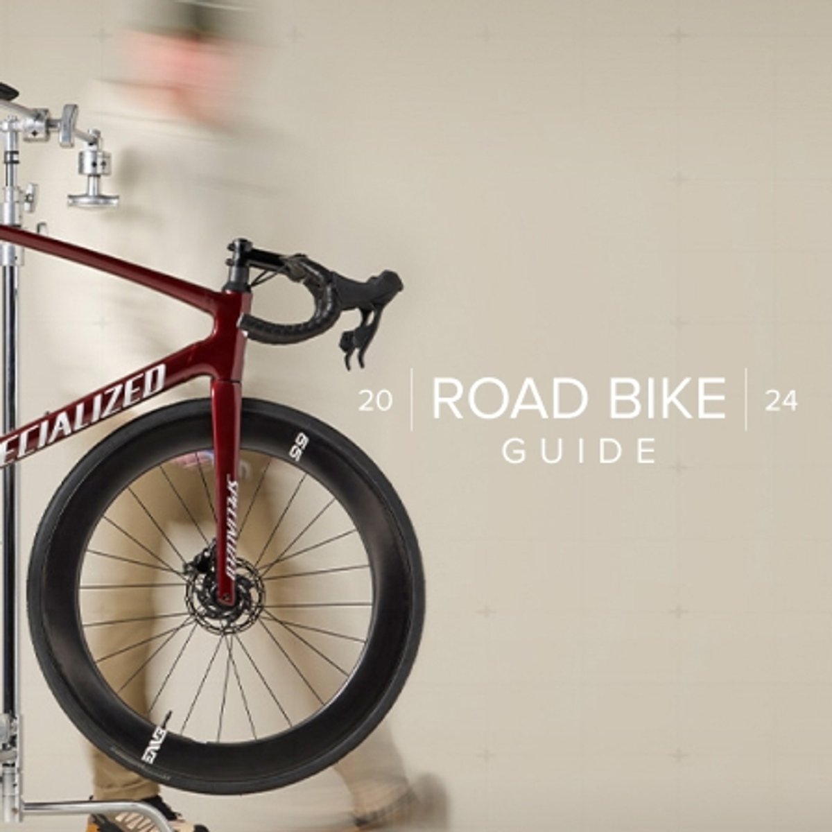 A person walks around a bike for the 2024 Road Bike Guide.