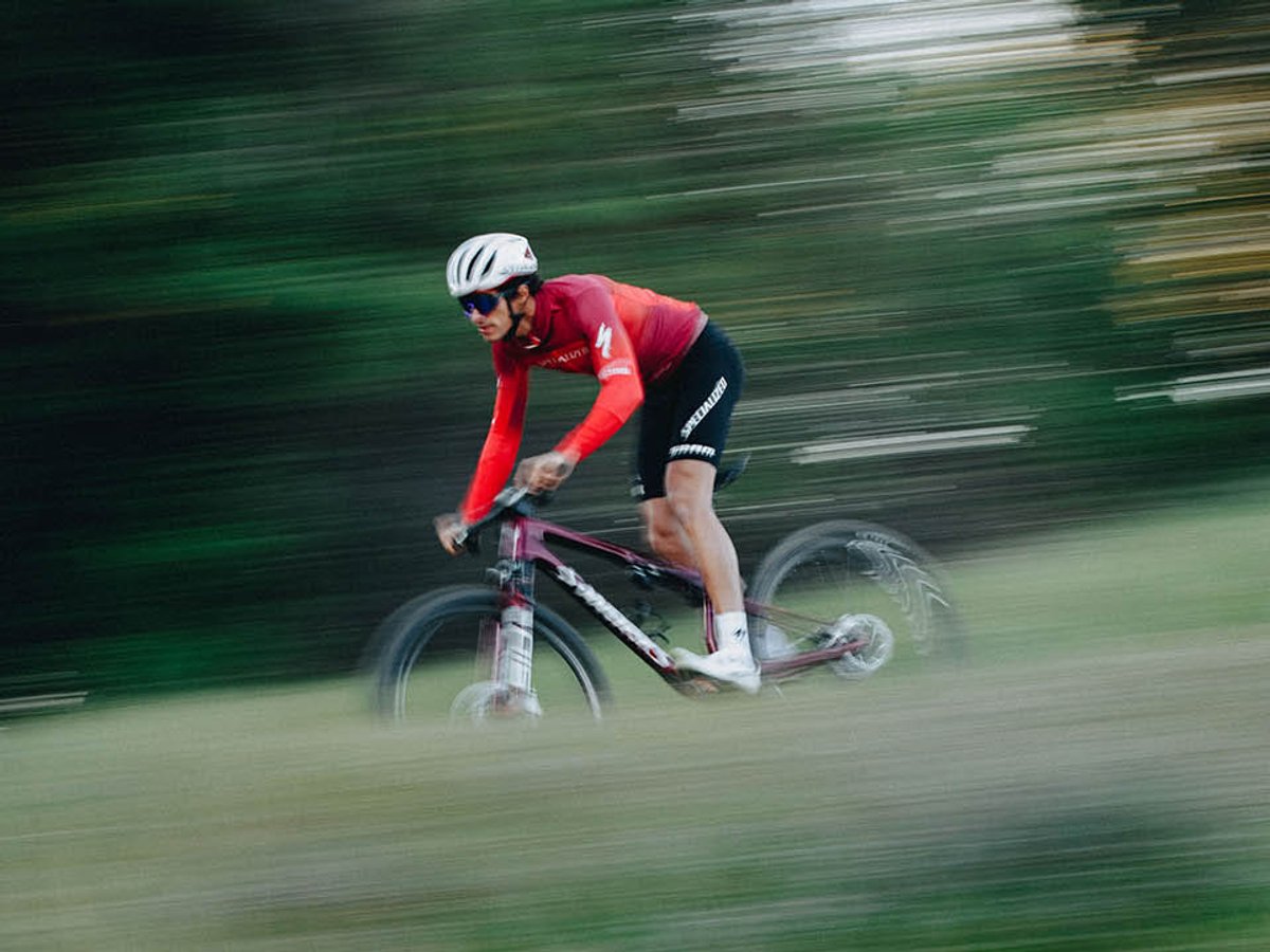 XC cyclist riding fast in a blur dowhnill.