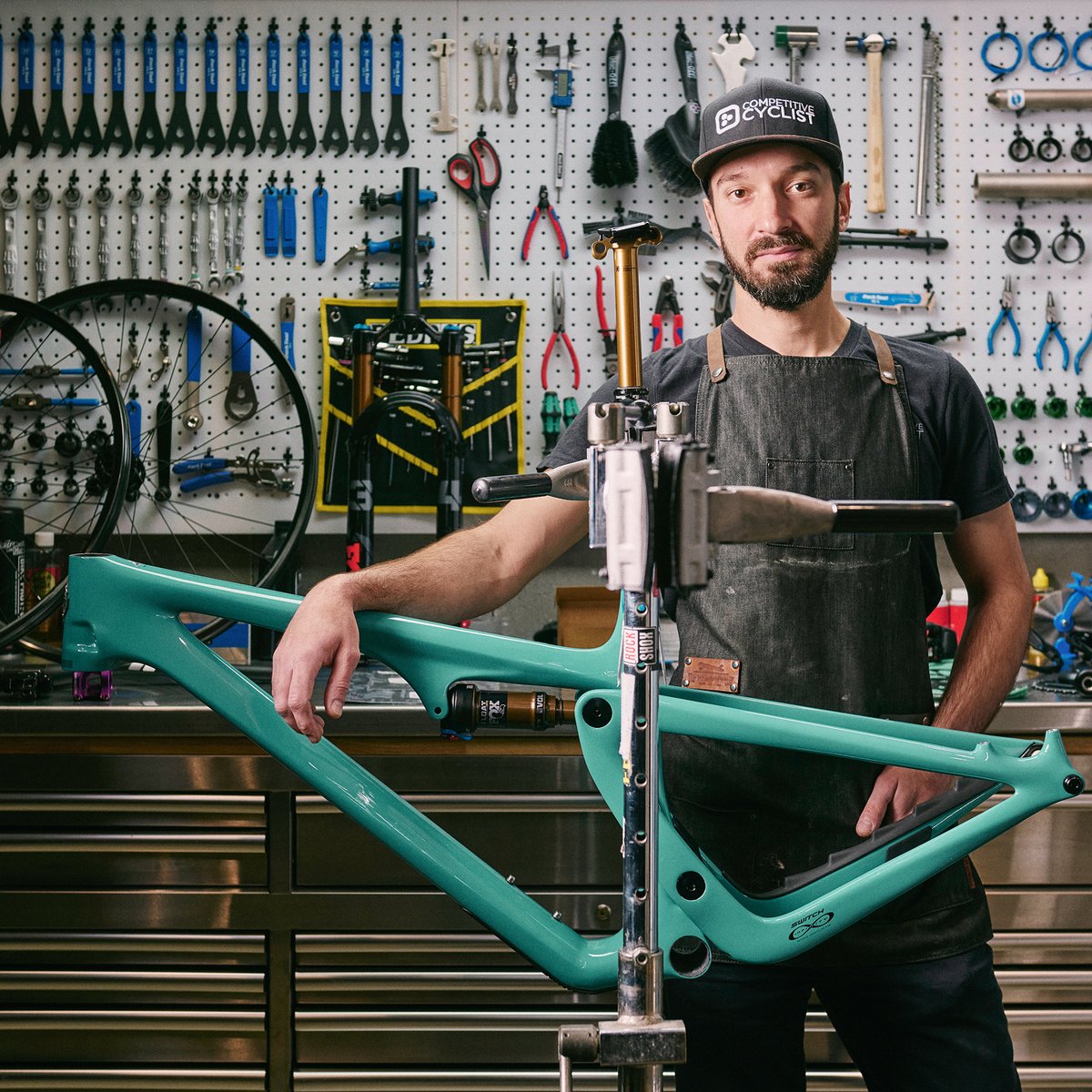 A friendly Gearhead teching a mountain bike.