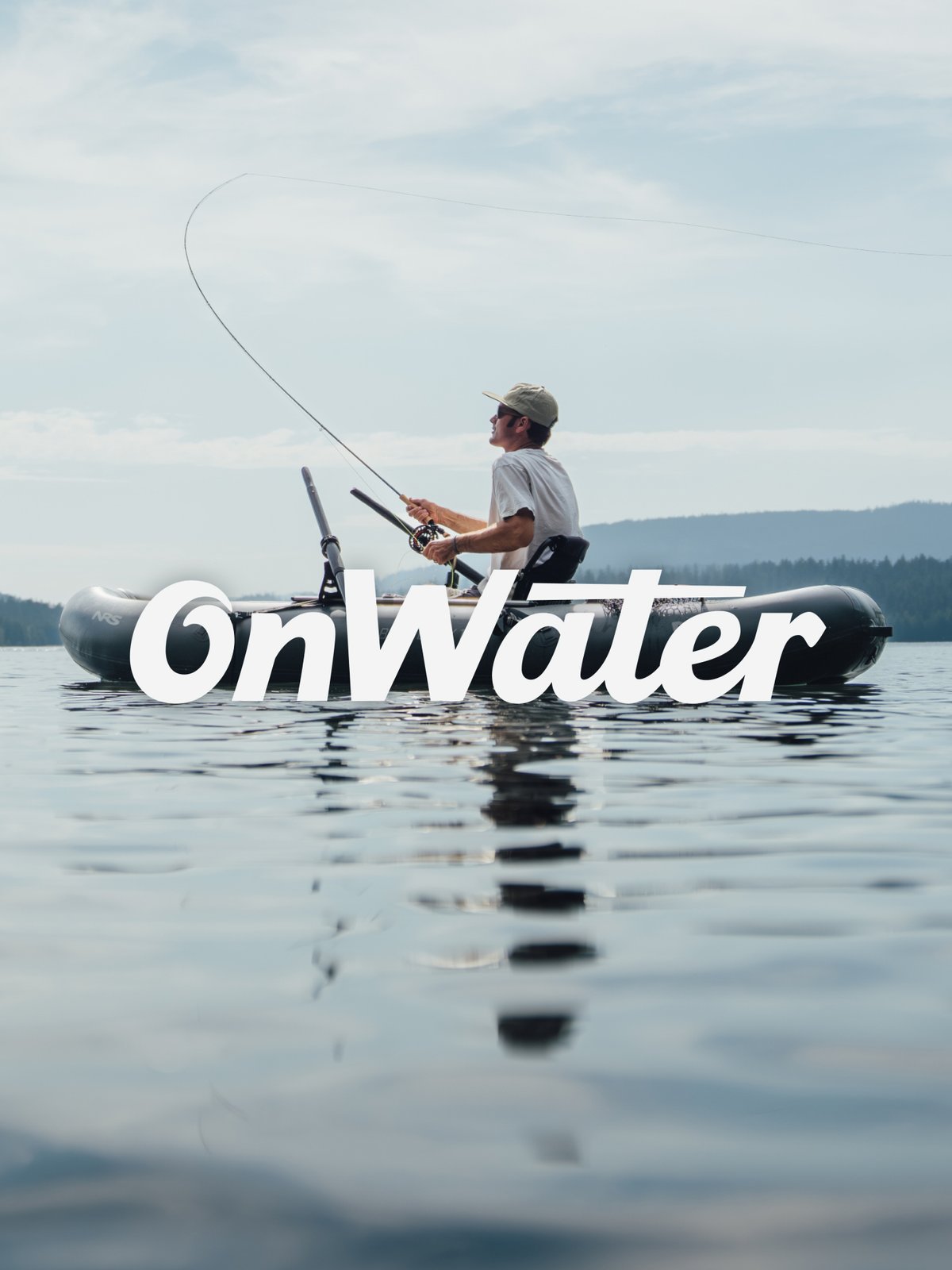 Angler fly casting from an inflatable raft on a calm lake with forested hills in the background, featuring the onWater logo.